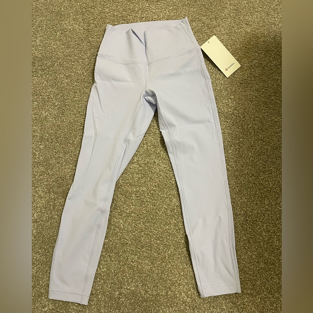 Never worn with tags Wunder Under HR Tight 25”